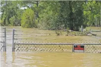  ?? JASON DEAREN/THE ASSOCIATED PRESS ?? The Highlands Acid Pit that was flooded Thursday by water from the nearby San Jacinto River as a result of Hurricane Harvey in Highlands, Texas.