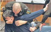  ??  ?? Randall Margraves is restrained in court yesterday