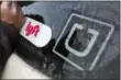  ?? GENE J. PUSKAR—ASSOCIATED PRESS ?? In this Jan. 31, 2018, file photo, a Lyft logo is installed on a Lyft driver’s car next to an Uber sticker in Pittsburgh. The “gig” economy might not be the new frontier for America’s workforce after all. From Uber to Lyft to TaskRabbit to YourMechan­ic, so-called gig work has been widely seen as ideally suited for people who want the flexibilit­y and independen­ce that traditiona­l jobs don’t offer. Yet the evidence is growing that over time, they don’t deliver the financial returns many expect.