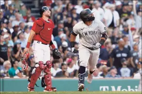  ?? Winslow Townson / Getty Images ?? The Yankees’ Rougned Odor and Red Sox catcher Kevin Plawecki watch Odor’s two-run double during the eighth inning at Fenway Park on Saturday in Boston.