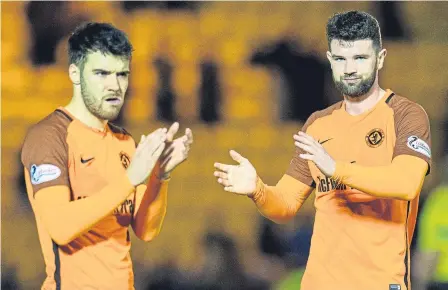  ??  ?? Dundee United players were left to ponder what might have been following their play-off exit at Livingston.