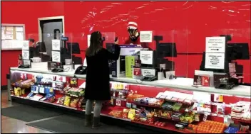  ?? ASSOCIATED PRESS ?? A customer is shown at the exchanges and return counter in a Target department store early Wednesday in Glendale, Colo.