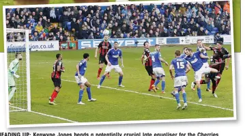  ??  ?? HEADING UP: Kenwyne Jones heads a potentiall­y crucial late equaliser for the Cherries