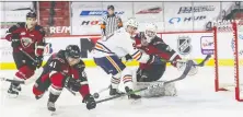  ?? ALLEN DOUGLAS ?? Vancouver Giants defenceman Alex Kannok Leipert, foreground, breaks up a chance during the team's season opener March 26.