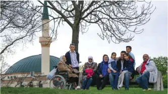  ??  ?? A family relaxes near the Islam Centre of Vienna on April 14, 2017 in Vienna. —AFP