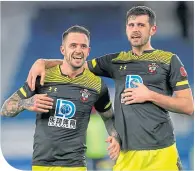  ??  ?? Southampto­n scorer Danny Ings, left, celebrates with team-mate Jack Stephens