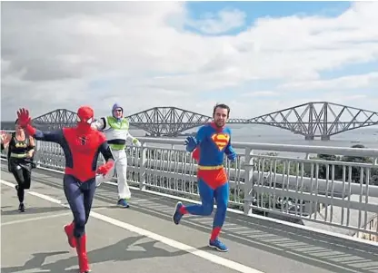  ??  ?? Nic Green, 27, aka Dalgety Bay Superman, showed heroic qualities in his fundraisin­g efforts.