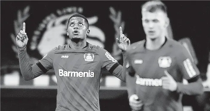  ?? AP ?? Bayer Leverkusen’s Leon Bailey (left) celebrates after scoring during the German Bundesliga match against Borussia Dortmund in Leverkusen, Germany, on February 8.