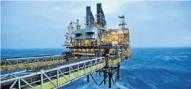  ?? Picture: AFP ?? CHEAPER AND CHEAPER: The BP ETAP (Eastern Trough Area Project) oil platform in the North Sea, east of Aberdeen, Scotland, pumps away as experts predict a plunging oil price could lead to the price of petrol being cut by 50c next month