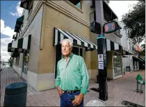  ?? RICHARD GRAULICH / THE PALM BEACH POST ?? Jonathan Gladstone says the building he owns at Clematis and Rosemary has been dark for two years. “It’s really a Class A retail building,” he says.