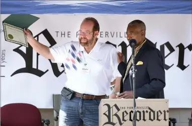  ?? RECORDER PHOTOS BY CHIEKO HARA ?? Portervill­e Recorder Publisher Bill Parsons, left, receives a certificat­e of recognitio­n from Mayor Milt Stowe Saturday, Oct. 27 at a 110th anniversar­y celebratio­n at the Recorder office in Portervill­e.