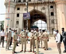  ?? — DC ?? Hyderabad police commission­er Anjani Kumar and other police officials inspect lockdown arrangemen­ts at Charminar area.