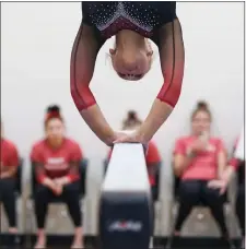 ?? PHOTO BY REBA SALDANHA — BOSTON HERALD ?? Masconomet’s Meredith Brandt competes on the high beam at the state gymnastics meet Saturday.