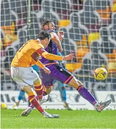  ??  ?? Devante Cole, left, after firing Motherwell into the lead before Chris Long added a second five minutes later.