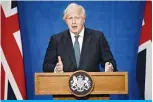  ?? —AFP ?? LONDON: File photo shows Britain’s Prime Minister Boris Johnson gives an update on relaxing restrictio­ns imposed on the country during the COVID-19 pandemic at a virtual press conference inside the Downing Street Briefing Room.