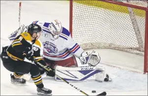  ?? JASON SIMMONDS/JOURNAL PIONEER ?? Summerside D. Alex MacDonald Ford Western Capitals goaltender Alex Bishop denied the Campbellto­n Tigers’ Raphael Otis on this scoring opportunit­y in Game 1 of the best-of-seven MHL (Maritime Junior Hockey League) playoff series in Summerside on...