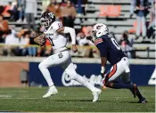  ?? AP Photo/Butch Dill ?? Texas A&M quarterbac­k Kellen Mond (11) scrambles away from pressure from Auburn linebacker Owen Pappoe (0) during the second half of an NCAA college football game on Saturday in Auburn, Ala.