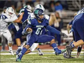  ?? CONTRIBUTE­D BY DANIEL VARNADO ?? Harrison running back David Roberts looks for an opening in Creekview’s defense in the second half of their game Friday. Harrison won 47-10.