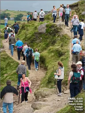  ?? ?? Trail: Each year 120,000 hikers climb Croagh Patrick