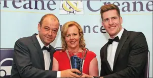  ??  ?? Mary Browne Vice President of New Ross Chamber of Commerce presenting Greg Doyle (left) and Pat Quinn of the Brandon House Hotel with the Excellence in Hospitalit­y Award sponsored by New Ross and District Chamber.