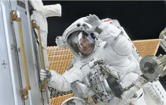  ?? NASA ?? Astronaut Tom Jones waves during his first career mission that installed the U.S. Destiny laboratory onto the Internatio­nal Space Station in February 2001.