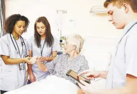  ?? Shuttersto­ck ?? Salaries for registered nurses with a bachelor’s degree are reported at $73,300 annually. Those with specialtie­s such as nurse anesthetis­ts, nurse midwives and nurse practition­ers with a graduate degree earn $115,800 per year.