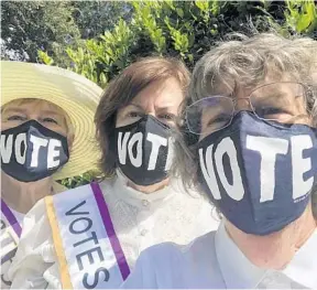  ?? LWVOC/COURTESY ?? The League ofWomen Voters of Orange County’s “100 Days to The Vote” campaign offers nonpartisa­n voter informatio­n as well as highlights from women’s suffrage history. League members, from left, Ann Patton, Martha Haynie, and Joan Erwin show off their “vote” masks.