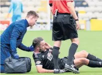  ??  ?? Sore one Imrie requires treatment after a clash