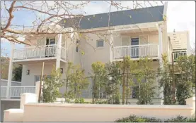  ??  ?? Wine cellars, super-large garages, upstairs balconies and private gardens are standard features at Nieuwe Steenberg, located on the Constantia Wine Route. This three-bedroom, three-bathroom show house is priced at R8.29m.