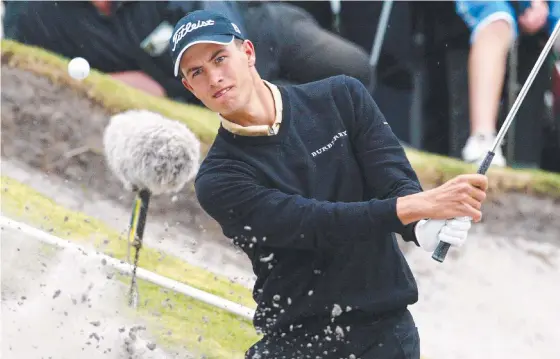  ??  ?? Adam Scott plays out of the bunker during his impressive year in 2002.