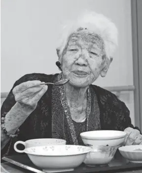  ?? ASAHI SHIMBUN VIA GETTY IMAGES ?? Japan’s oldest person Kane Tanaka, 119, has lunch at a nursing home in 2018 in Fukuoka, Japan.