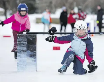  ??  ?? Quinn Salisbury, 5, right, and Siobhan Gillis, 6, make their way through an obstacle course.