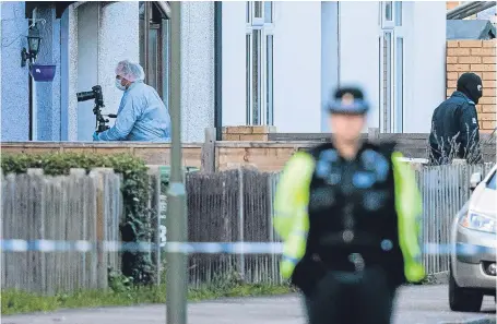  ?? Pictures: Getty and PA. ?? Above: the home in Sunbury, Surrey, of Penelope and Ronald Jones is searched. Below: Police keep guard at an address in Stanwell, also Surrey, which is also being searched by terror officers.