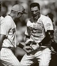  ?? THE ASSOCIATED PRESS DAVID ZALUBOWSKI/ ?? The Rockies’ Nolan Arenado, right, celebrates his three-run, walkoff home run with teammate Pat Valaika in the ninth inning Sunday against the Giants in Denver. Arenado hit for the cycle, leading Colorado to a 7-5 win.