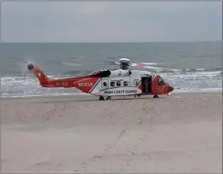  ??  ?? The Coastguard rescue helicopter at Curracloe beach on Saturday afternoon.