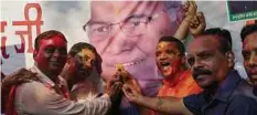 ??  ?? PENYOKONG parti pelampau Hindu meraikan kemenangan calon mereka di New Delhi, semalam. - AFP