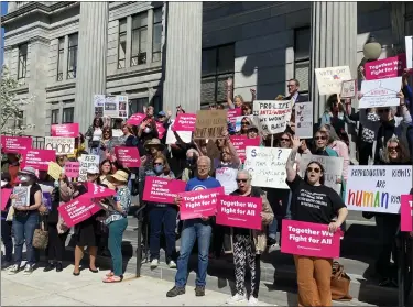  ?? PHOTO BY CARL HESSLER JR. ?? Advocates for abortion rights and women’s health carried signs, sang protest anthems and shouted “we will not go back” at a rally outside the Montgomery County Courthouse on May 9, 2022.