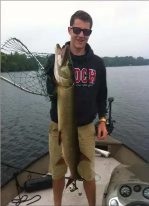  ??  ?? Caleb Radley with his 45-inch muskie on Sturgeon Lake.