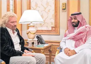  ?? SAUDI PRESS AGENCY/AGENCE FRANCE FILE PHOTO ?? Businessma­n Richard Branson meets with Saudi Crown Prince Mohammed bin Salman in 2017. Branson is now one of many CEOs scrambling to preserve their relationsh­ips with Saudi Arabia.