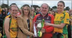  ??  ?? Joint Captains Michelle McArdle and Orlagh Byrne receive ‘Josephine’ from Cheryl Halpenny, Halpenny Travel and Dermot Woods, Chairman.