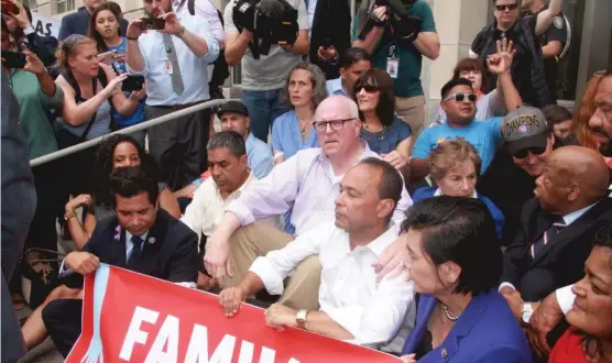  ?? PHOTO COURTESY OFFICE OF REP. LUIS GUTIERREZ ?? House Democrats protest in front of Customs and Border Patrol Headquarte­rs: ( from left) Rep. Jimmy Gomez, Rep. Adriano Espaillat, Rep. Joe Crowley, Rep. Luis Gutierrez and Rep. Jan Schakowsky ( behind Gutierrez.) In the back at right are actor John...
