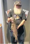  ?? FPD OF WILL COUNTY ?? Dan Burklow, of Park Forest, caught a 29-inch catfish to win that category of the Big Fish Contest at the Monee Reservoir.
