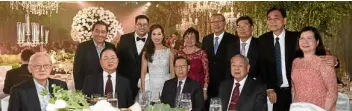  ??  ?? The couple with members of the Chinese-Filipino Business Club: (standing) Stephen Sia, Aaron and Maika, Jenny and Johnny Lee, Allan Wong But Loy, Emil and Dr. Teresita Tan; Cristino Lim, William Yap, Tomas Ang, Peter Yu