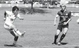  ?? BILL KEMP Special to the Miami Herald ?? Downtown Doral junior Jose Uzcategul drills a game-tying goal during the first half of the Class 3A state championsh­ip game against Tampa Prep on Saturday afternoon at Lake Myrtle Park in Auburndale.