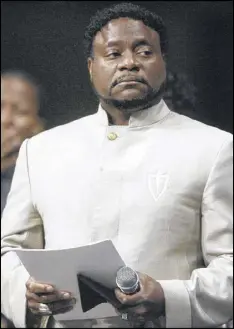  ?? JOHN AMIS / AP FILE ?? Bishop Eddie Long prepares to speak at New Birth Missionary Baptist Church near Atlanta. Before his illness, Long, the son of a Baptist minister, was a physically imposing figure. “It helps in the board meetings,” he said. “In the old days, the deacons...