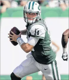  ??  ?? AP PHOTO In this Sept. 16 file photo, New York Jets’ Sam Darnold (14) rolls out during the first half of an NFL football game against the Miami Dolphins in East Rutherford, N.J.