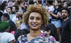  ?? Ellis Rua/Associated Press ?? Brazilian police officers on Sunday arrested two men on accusation­s that they ordered Rio de Janeiro Councilwom­an Marielle Franco’s murder to silence her battles against corruption. Franco and her driver, Anderson Pedro Gomes, were killed in March 2018 when a gunman sprayed their car with bullets.