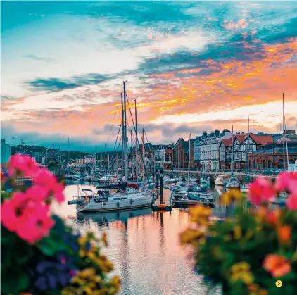  ?? ?? Right: Sunset over the harbour in Douglas, the island’s capital