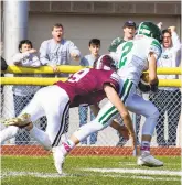  ?? JANE THERESE/SPECIAL TO THE MORNING CALL ?? Pen Argyl’s Colin McKeague runs for a touchdown as Bangor’s Zach Karner tries in vain to bring him down Saturday during the 100th meeting of the Slate Belt rivals in Bangor.