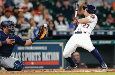  ?? Karen Warren / Houston Chronicle ?? Jose Altuve finds a second-inning pitch from the Mariners’ Erasmo Ramirez a little too close for comfort on Saturday. The AL batting leader finished 2-for-4 with a walk and two runs in the Astros’ 8-6 win over Seattle.